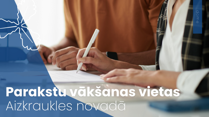 divi cilvēki paraksta dokumentus